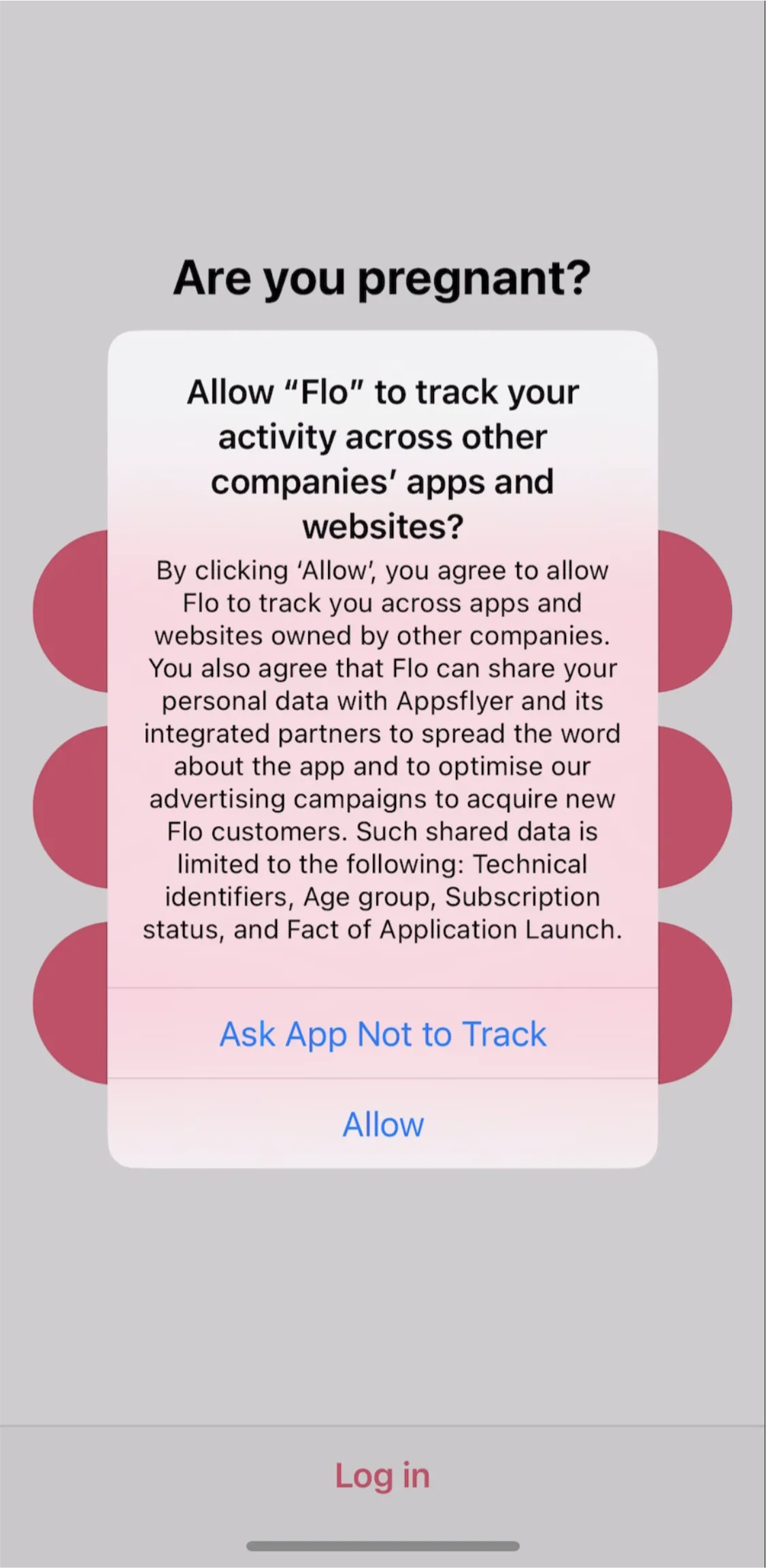 Flo tracking permission prompt shown on top of the “Are you pregnant?” question